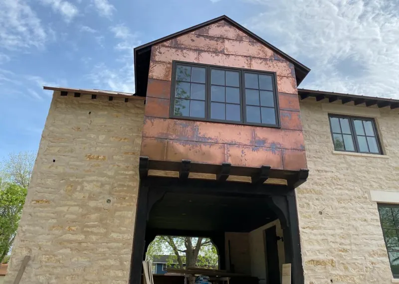 Copper metal panel facade on a stone building for Skylight Installation in Orland Park