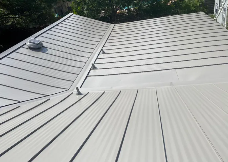 Solar attic fan installed on a metal roof for Roof Ventilation in Orland Park